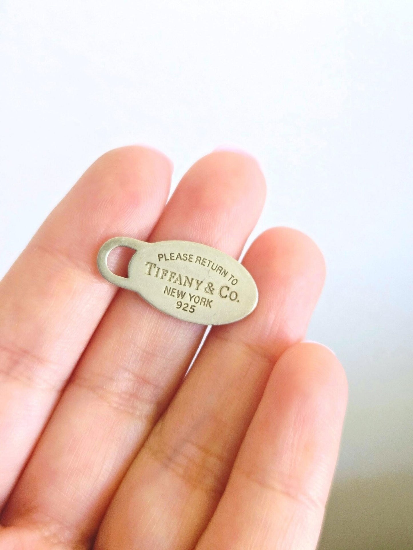 Return to Tiffany & Co New York Oval Tag Pendant 925 Sterling Silver